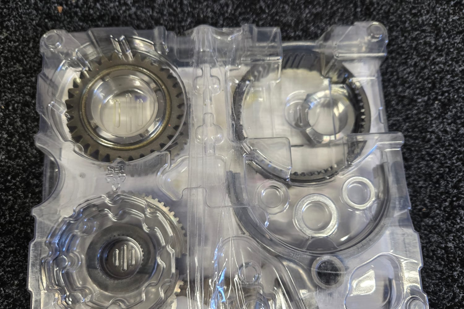 A new gear set and bearings still sealed in the supplier’s packaging, ready to go into a performance build