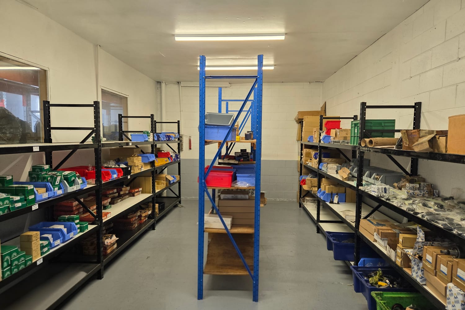 The parts store at Antigua Street - shelving of boxed new gearbox parts and bearings for the trade
